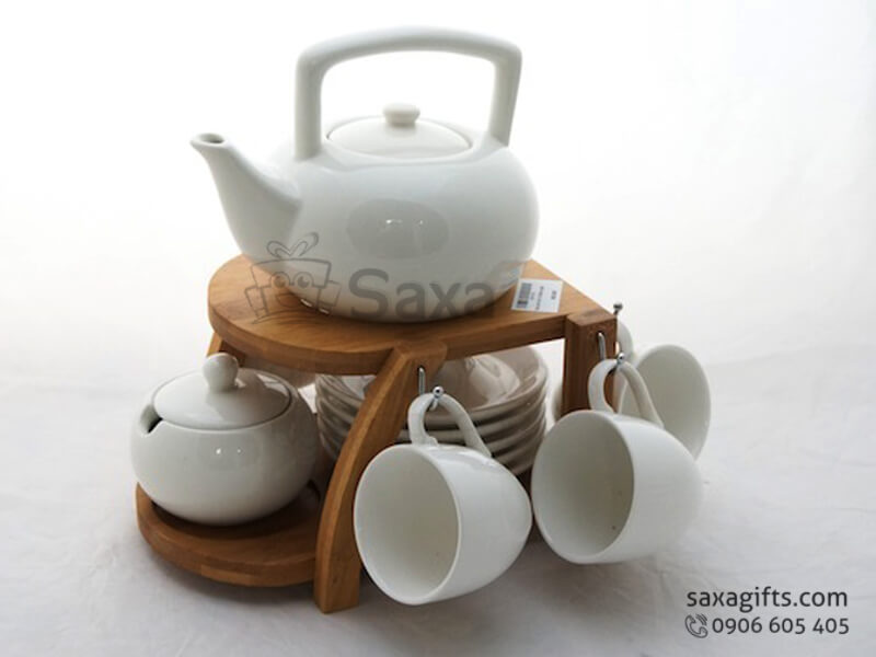 Ceramic tea set with wooden cup holder from Minh Long